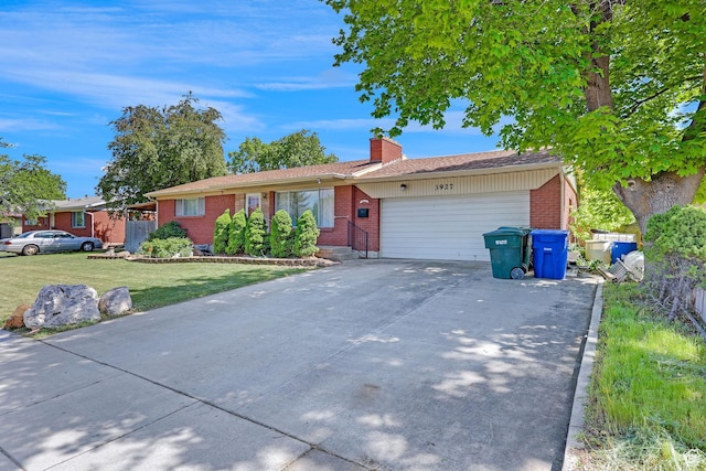 3927 W Rawhide Dr S, West Valley City, UT 84120 - single story home with brick siding, an attached garage, a chimney, concrete driveway, and a front lawn