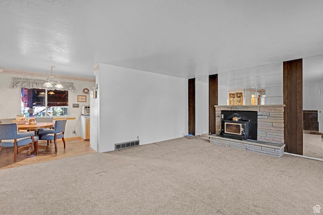 3927 W Rawhide Dr S, West Valley City, UT 84120 - carpeted living area featuring a fireplace