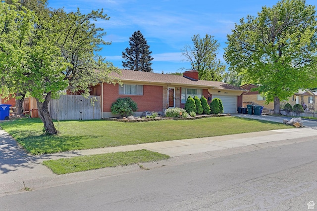 3927 W Rawhide Dr S, West Valley City, UT 84120 - single story home featuring brick siding, a garage, a chimney, and driveway