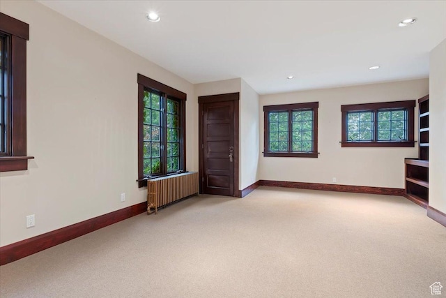 34 S Haxton Pl, Salt Lake City, UT 84102 - spare room with radiator, carpet floors, baseboards, and recessed lighting