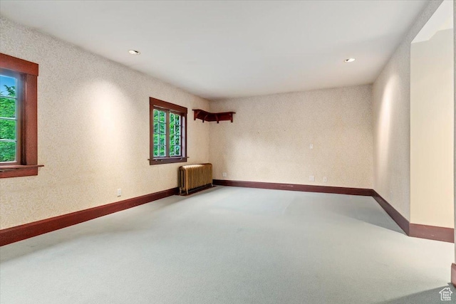 34 S Haxton Pl, Salt Lake City, UT 84102 - carpeted empty room featuring radiator heating unit, recessed lighting, and baseboards
