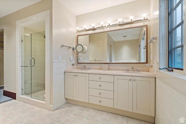 34 S Haxton Pl, Salt Lake City, UT 84102 - bathroom featuring a stall shower, double vanity, and tile patterned floors
