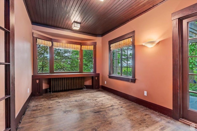 34 S Haxton Pl, Salt Lake City, UT 84102 - spare room featuring radiator, wood finished floors, baseboards, and wood ceiling