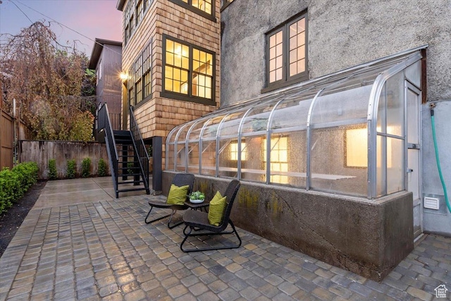 35 S Haxton Pl, Salt Lake City, UT 84102 - view of patio featuring stairway, fence, and a sunroom