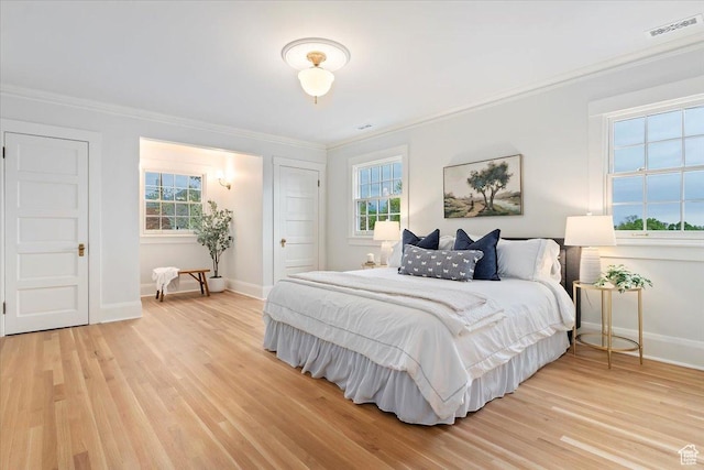 35 S Haxton Pl, Salt Lake City, UT 84102 - bedroom with ornamental molding, light wood finished floors, and baseboards