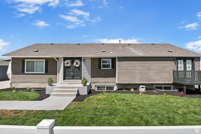 13956 S Wild Colt Cir, Herriman, UT 84096 - view of front of home with a front yard, roof with shingles, and french doors