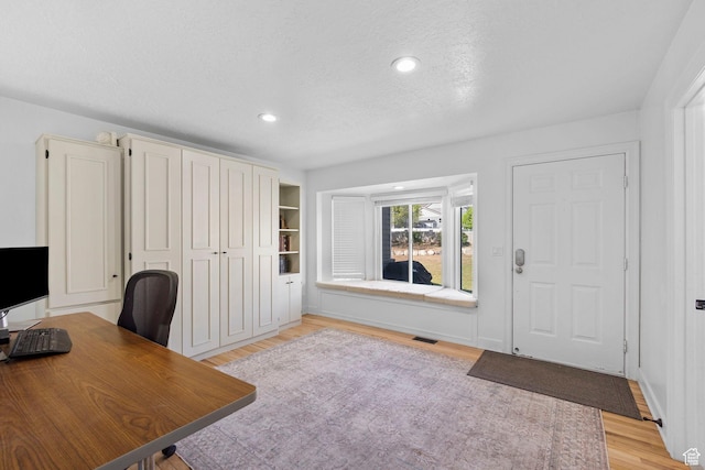 13956 S Wild Colt Cir, Herriman, UT 84096 - office space featuring light wood-style flooring, recessed lighting, and a textured ceiling