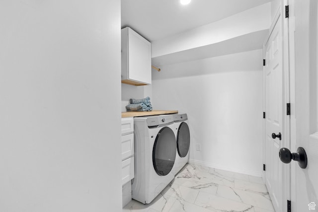 13956 S Wild Colt Cir, Herriman, UT 84096 - clothes washing area featuring washing machine and dryer, light marble finish flooring, cabinet space, and baseboards
