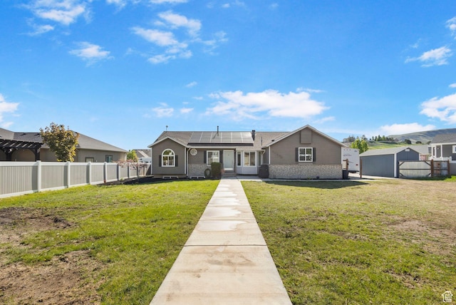 13956 S Wild Colt Cir, Herriman, UT 84096 - ranch-style house with roof mounted solar panels, a shed, brick siding, and an outdoor structure