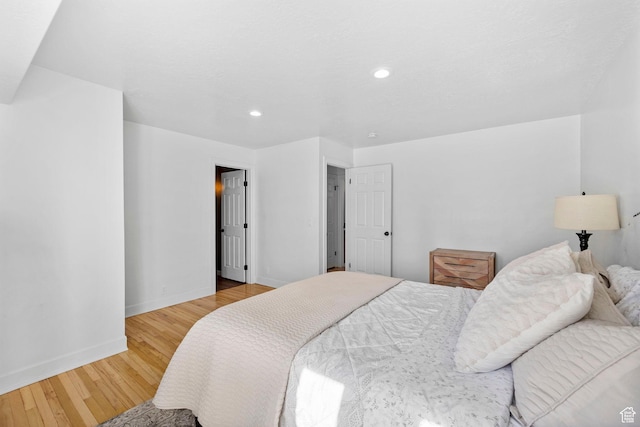 13956 S Wild Colt Cir, Herriman, UT 84096 - bedroom featuring wood finished floors, baseboards, and recessed lighting