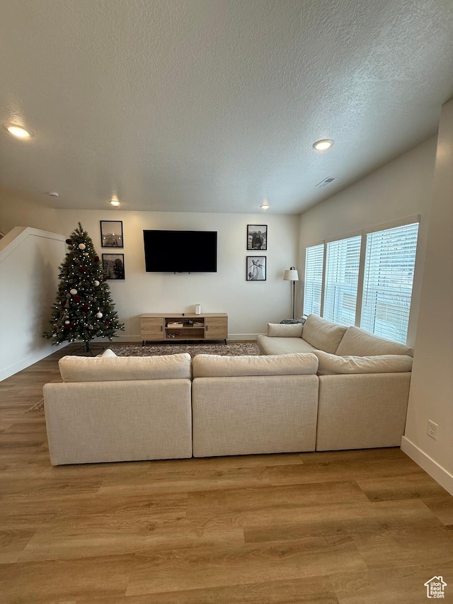 81 W 925 N, Brigham City, UT 84302 - living area featuring recessed lighting, light wood-style floors, a textured ceiling, and baseboards