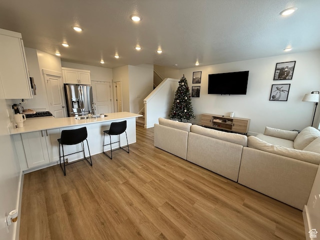 81 W 925 N, Brigham City, UT 84302 - living area with stairs, recessed lighting, and light wood-type flooring
