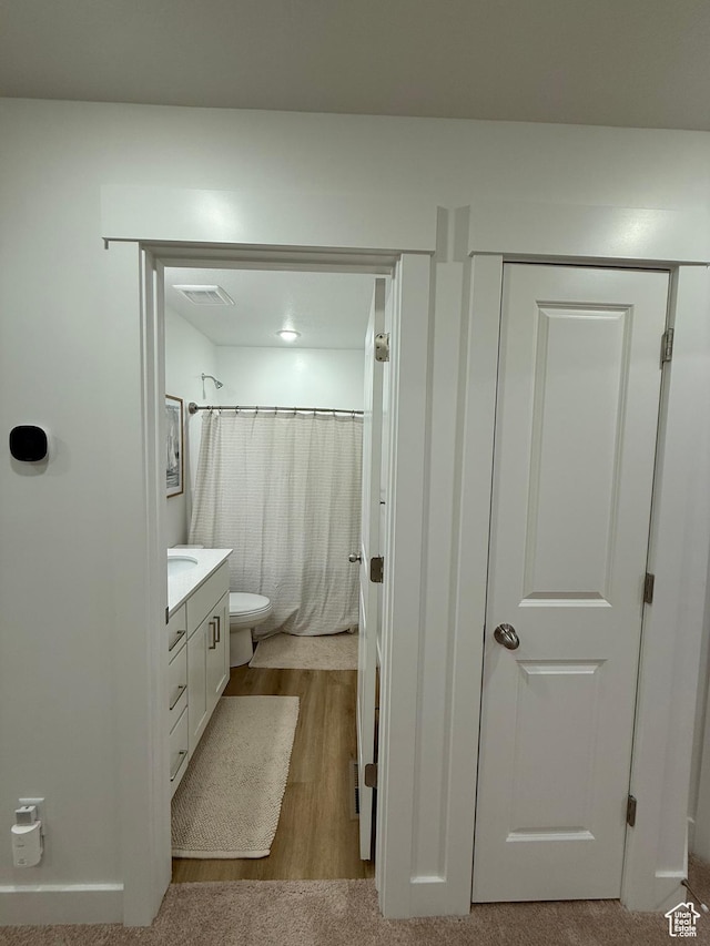 81 W 925 N, Brigham City, UT 84302 - full bath featuring vanity, toilet, wood finished floors, and a shower with curtain