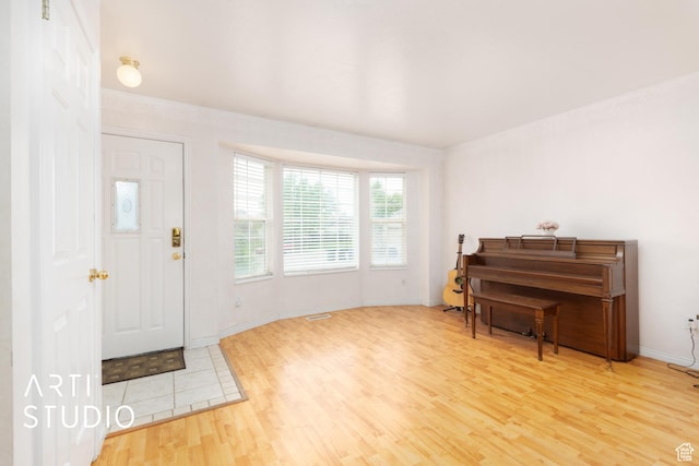 2956 W Mackay Meadows Pl, West Valley City, UT 84119 - foyer featuring wood finished floors and baseboards