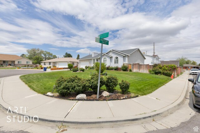 2956 W Mackay Meadows Pl, West Valley City, UT 84119 - ranch-style house with a residential view and a garage