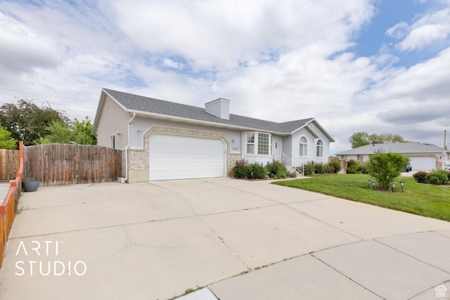 2956 W Mackay Meadows Pl, West Valley City, UT 84119 - ranch-style house with an attached garage, concrete driveway, stucco siding, and a chimney