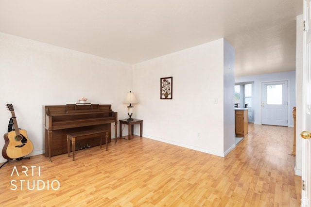 2956 W Mackay Meadows Pl, West Valley City, UT 84119 - living area with light wood-type flooring and baseboards