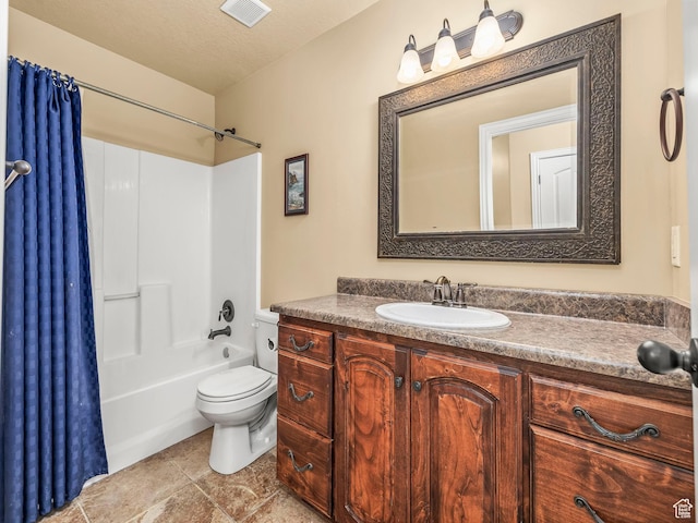 full bath featuring toilet, vanity, shower / bath combination with curtain, and tile patterned floors