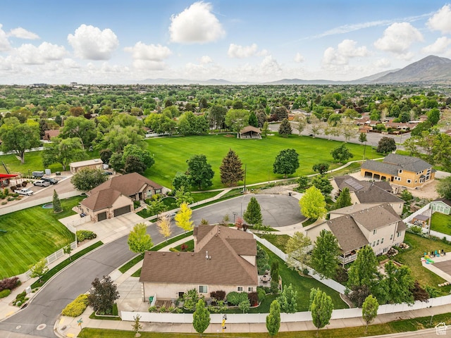 aerial view of residential area featuring a mountainous background