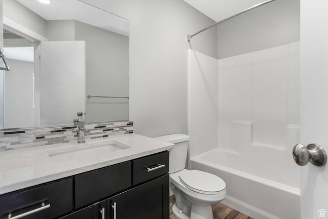 5368 W Sonova Ln S, Herriman, UT 84096 - full bathroom featuring toilet, tasteful backsplash, wood finished floors, vanity, and shower / tub combination