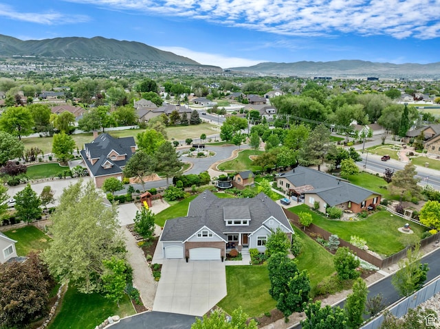 aerial view of residential area featuring mountains