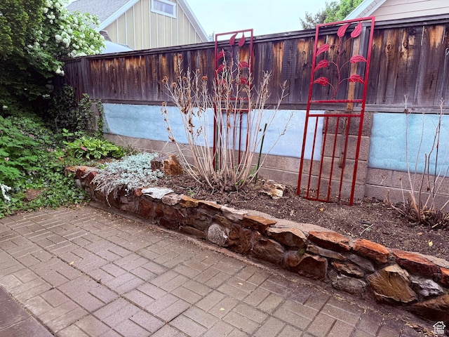 view of patio / terrace featuring fence