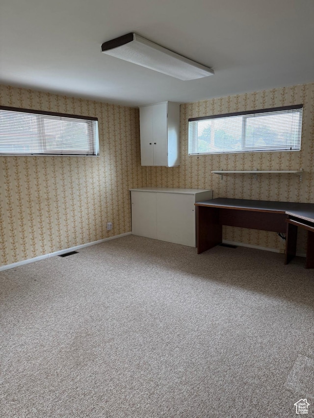 empty room featuring carpet flooring