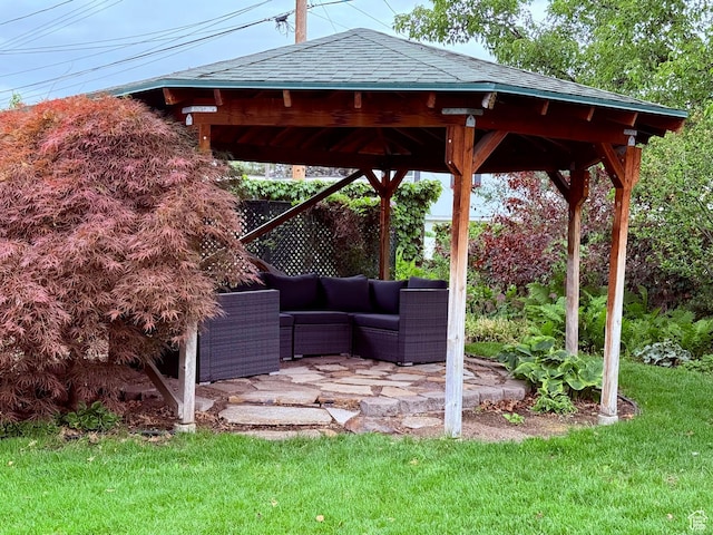 view of grassy yard with a gazebo, outdoor lounge area, and a patio area