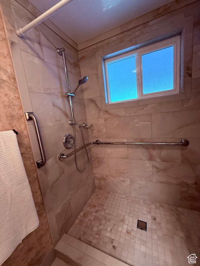 bathroom with a shower stall