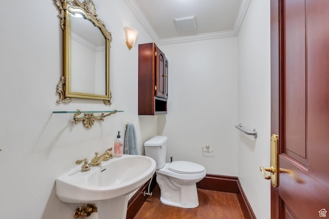 3223 Apache Ln, Provo, UT 84604 - bathroom with wood finished floors, toilet, crown molding, a sink, and baseboards