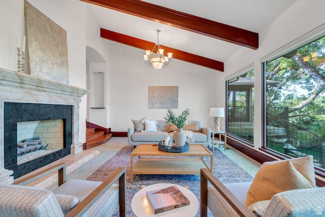 3223 Apache Ln, Provo, UT 84604 - living room featuring a chandelier, a high end fireplace, and arched walkways