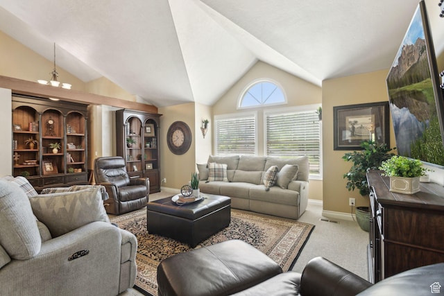 living room featuring lofted ceiling, baseboards, and carpet
