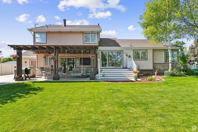 rear view of house with stucco siding, a patio, and ceiling fan