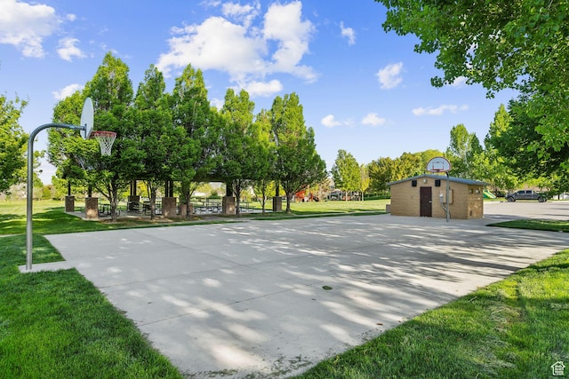 view of sport court with community basketball court and a lawn
