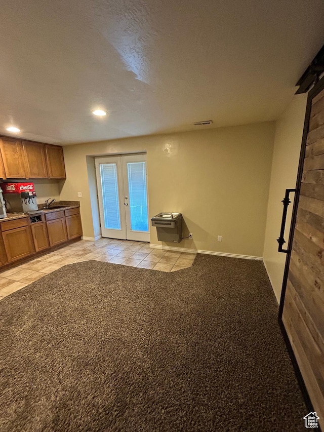 642 W 1250 S, Lehi, UT 84043 - kitchen featuring french doors, brown cabinetry, recessed lighting, baseboards, and light tile patterned floors