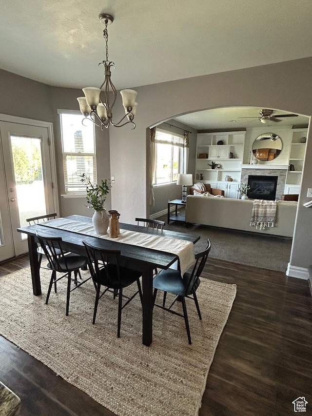 642 W 1250 S, Lehi, UT 84043 - dining room featuring arched walkways, a chandelier, dark wood-style floors, and baseboards