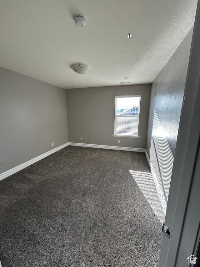 642 W 1250 S, Lehi, UT 84043 - spare room with dark colored carpet, baseboards, a smoke detector, and a textured ceiling