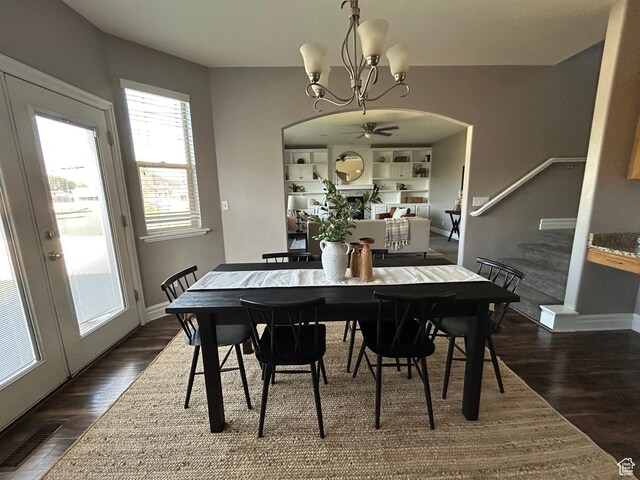 642 W 1250 S, Lehi, UT 84043 - dining room with a chandelier, arched walkways, dark wood-type flooring, and baseboards