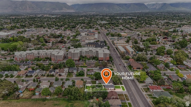 aerial view of property's location with a mountainous background