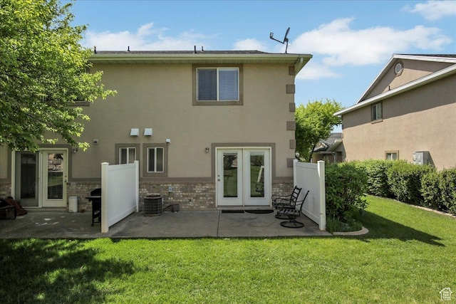 2421 N 400 E Unit M-1, North Ogden, UT 84414 - back of house with french doors, cooling unit, a patio, a lawn, and stucco siding