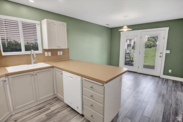 2421 N 400 E Unit M-1, North Ogden, UT 84414 - kitchen featuring dishwasher, a sink, a peninsula, healthy amount of natural light, and recessed lighting