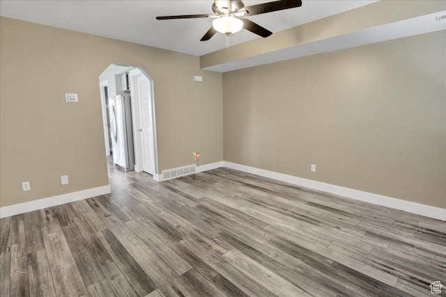 2421 N 400 E Unit M-1, North Ogden, UT 84414 - empty room with a ceiling fan, arched walkways, wood finished floors, and baseboards