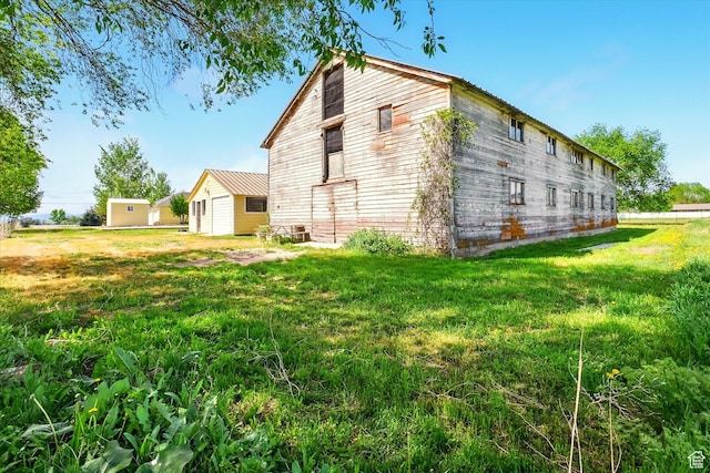 2897 W 3400 N, Benson, UT 84335 - view of side of property featuring a yard