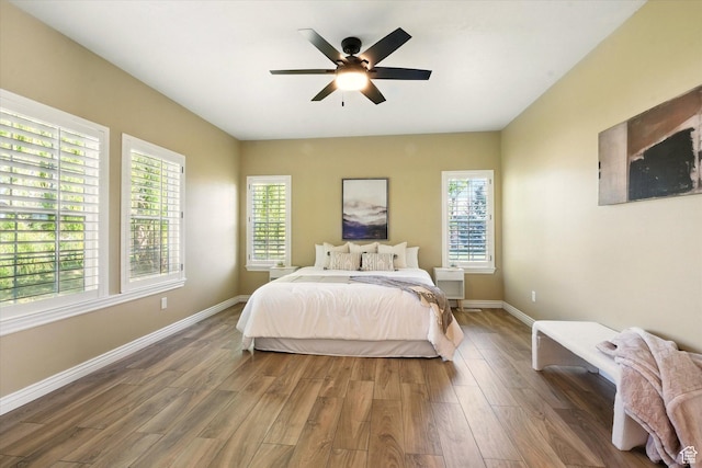 2897 W 3400 N, Benson, UT 84335 - bedroom featuring wood finished floors, baseboards, and ceiling fan