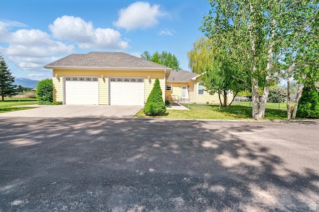 2897 W 3400 N, Benson, UT 84335 - view of front of house featuring a front yard and driveway