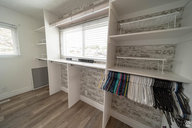 walk in closet featuring light wood-type flooring