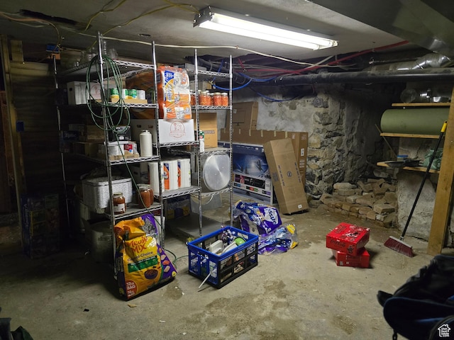 unfinished basement featuring oil tank