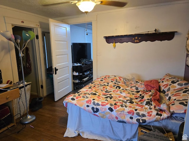 bedroom with dark wood finished floors and ceiling fan