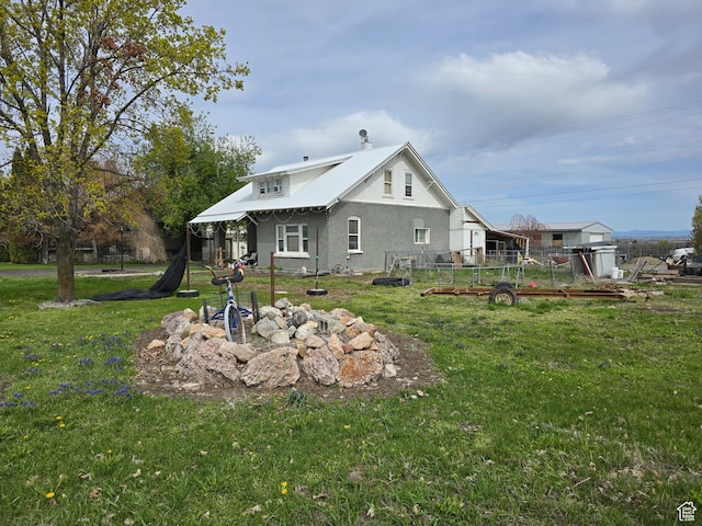 back of house with stucco siding