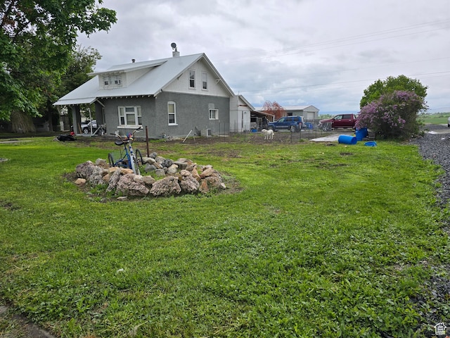 rear view of property with stucco siding
